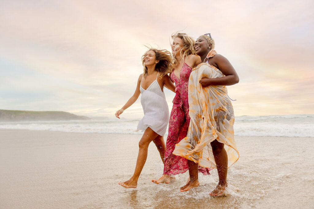 Women on beach with more confidence after seeing a plastic surgeon in East Islip Long Island