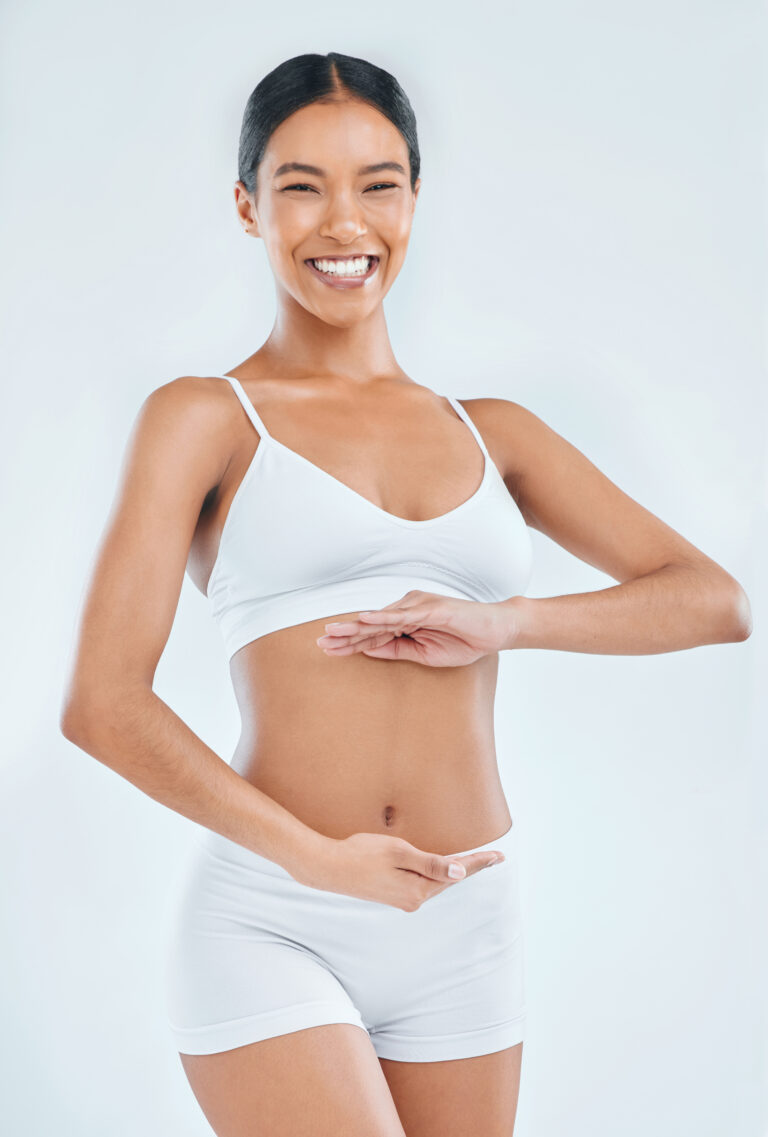 Confident woman after tummy tuck in New York City