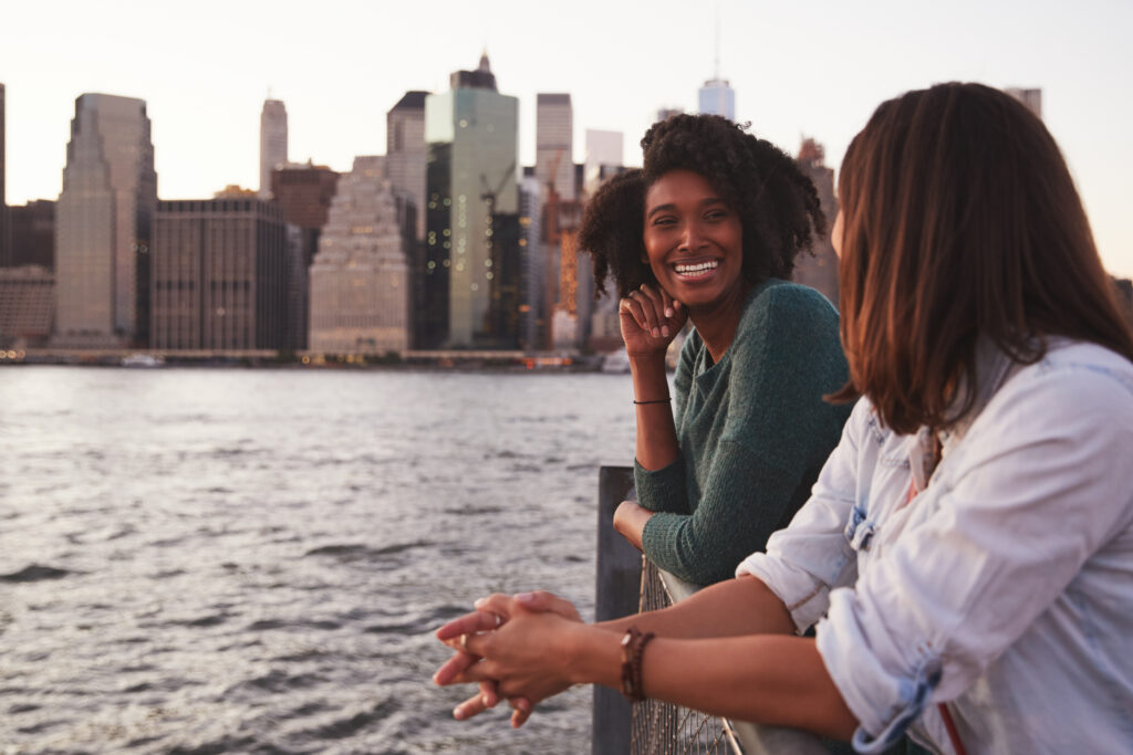 Female friends laughing together in New York City