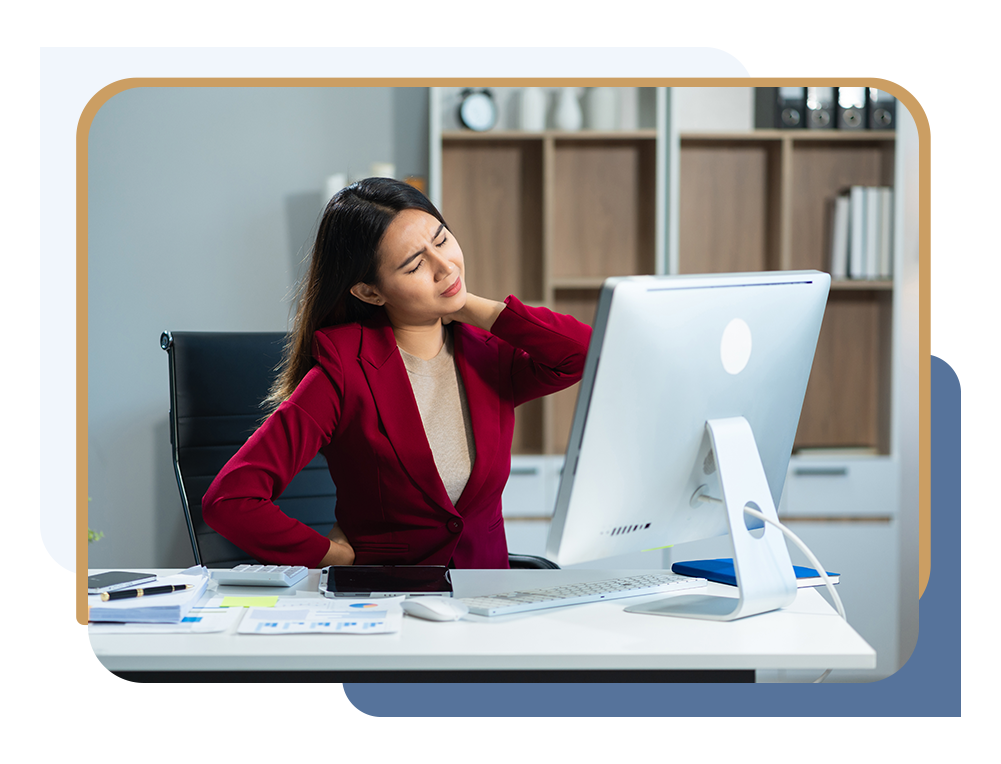Woman sitting at desk with poor posture before breast reduction