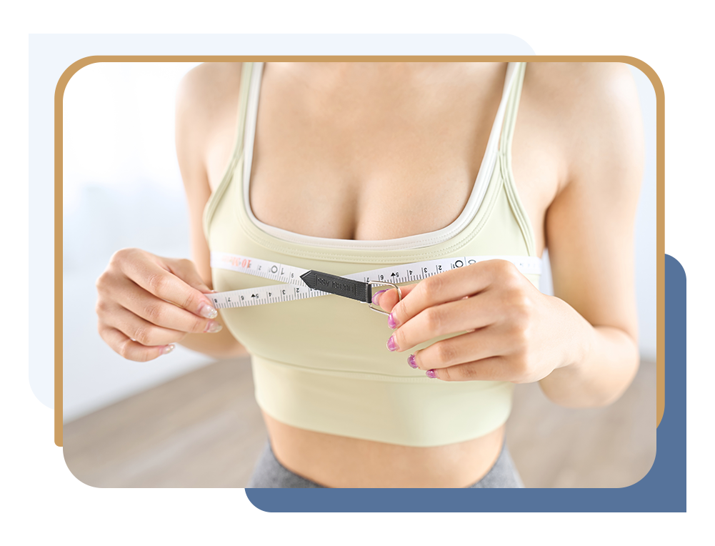 Woman measuring her breasts before breast reduction