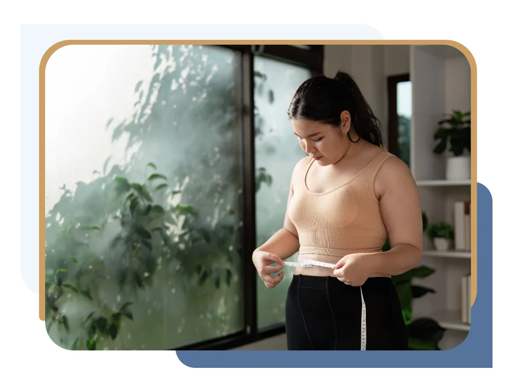 Woman with measuring tape considering breast reduction after weight loss