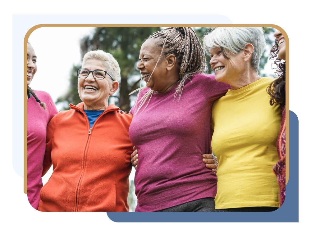 Group of smiling women standing outdoors with arms around each other