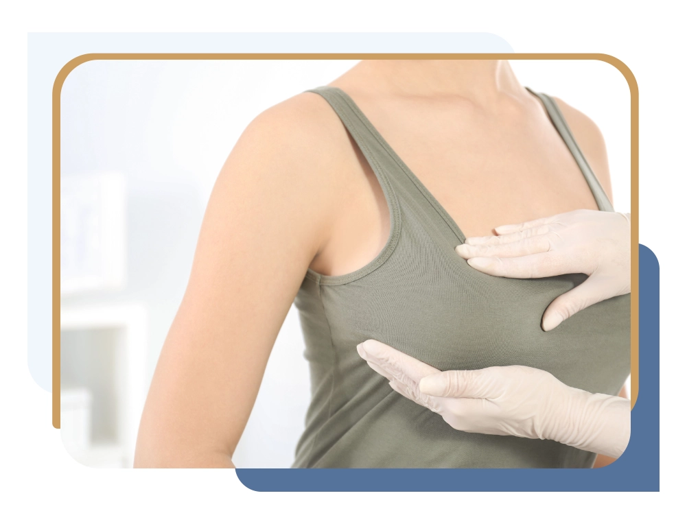 Plastic surgeon examining patient’s breasts and explaining breast reduction vs augmentation