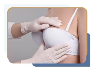Surgeon examining patient to determine whether liposuction breast reduction vs traditional breast reduction is more appropriate