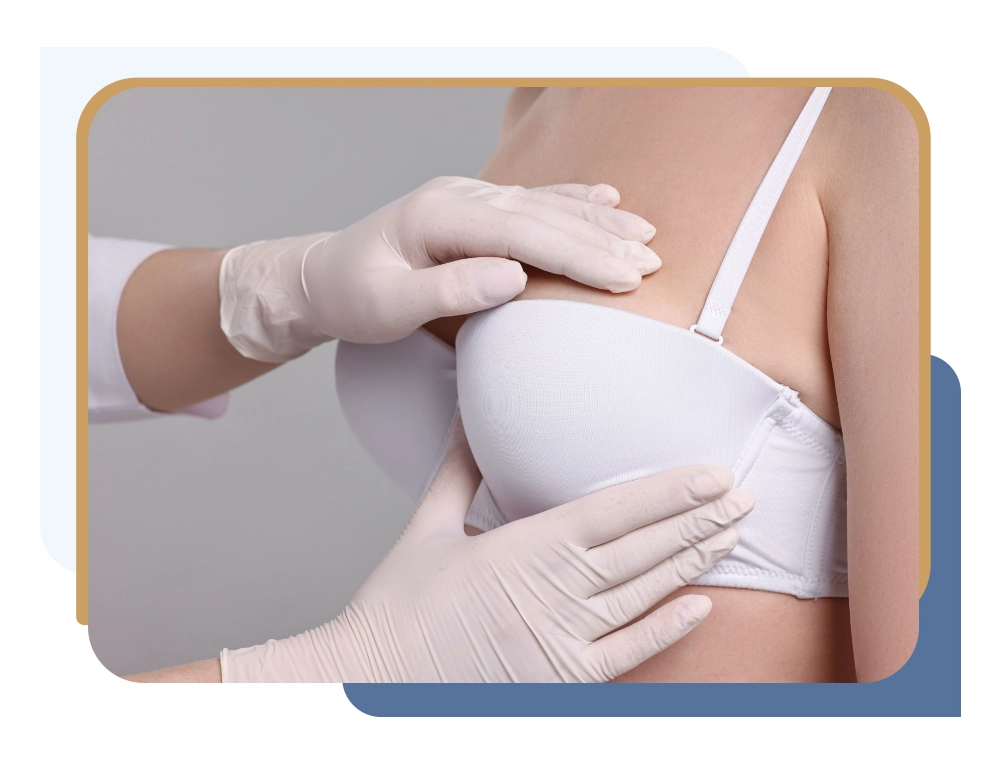 Surgeon examining patient to determine whether liposuction breast reduction vs traditional breast reduction is more appropriate