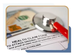 An image with a health claim form, stethoscope, and U.S. currency, symbolizing appealing a breast reduction insurance denial